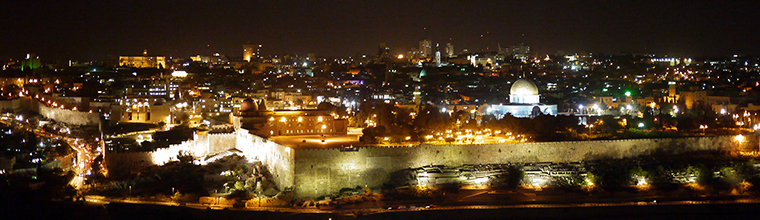 Jerusalem, the Old City.  The serenity and beauty of the evening lights belies the underlying conflict within the walls of this sacred city filled with a plethora of historic and religious sites.  The most visible structure is the Dome of the Rock located on Temple Mount (Har HaMoriyah) built about 1400 years ago during the first Muslim conquest.  This is the same site the first Jewish temple was built 1000 years before Christ. The dome covers a slab of stone sacred to both Muslim and Jewish faiths. This evening panoramic view from Mt. Olive was taken  with a Panasonic DMC-GF1 camera using a 10-second delay timer. Jerusalem, West Bank, Israel.  November 2, 2010. - Laurel Pfund